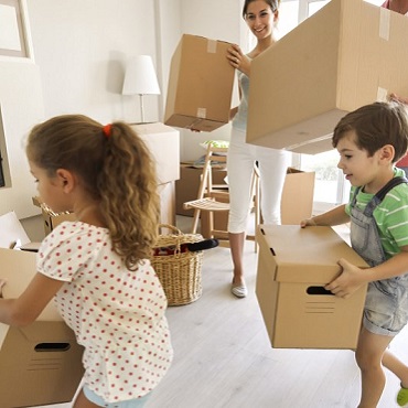 family-carrying-moving-boxes